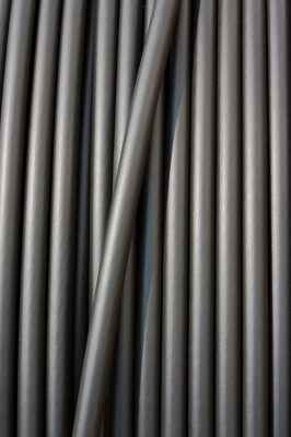 Close-up Of Black Electricity Paralled lines in Cable Vertical On A Spool