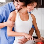 romantic couple enjoying their love in kitchen