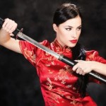 "Woman Holding Katana Weapon" by marin