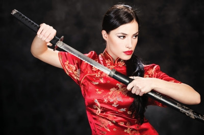 "Woman Holding Katana Weapon" by marin